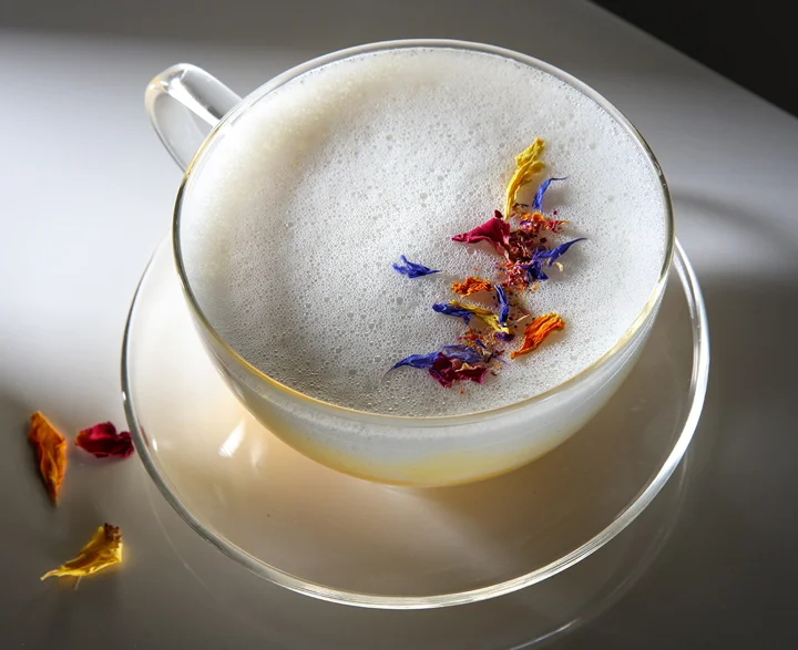 The Earth drink served in a clear teacup and saucer.