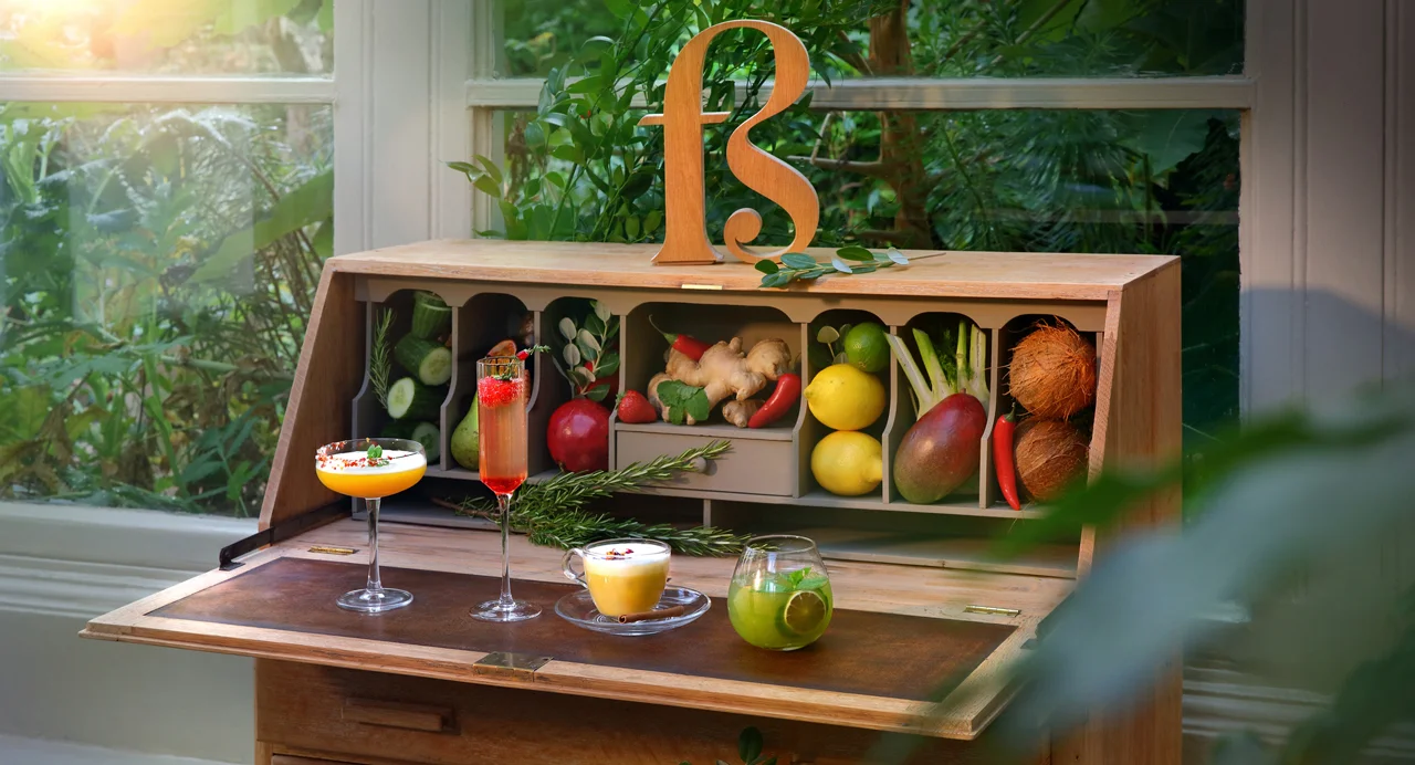 Four Free Spirit drinks — Earth, Fire, Ether and Air — served in cocktail glasses.